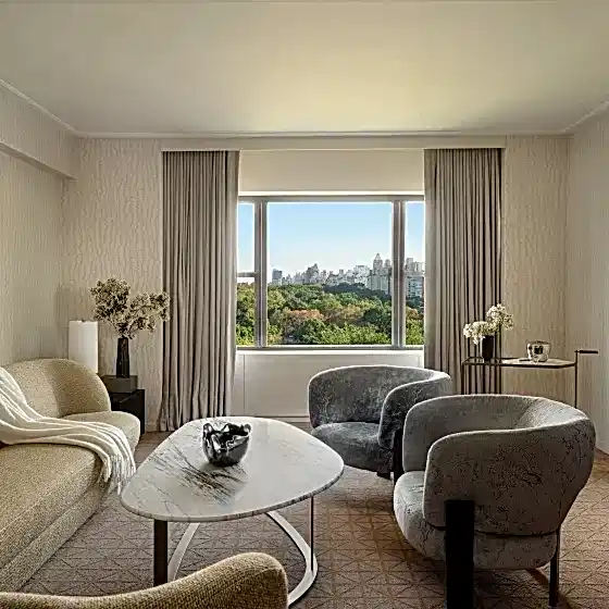 The seating area of a one bedroom suite overlooking Central Park at Park Lane New York.