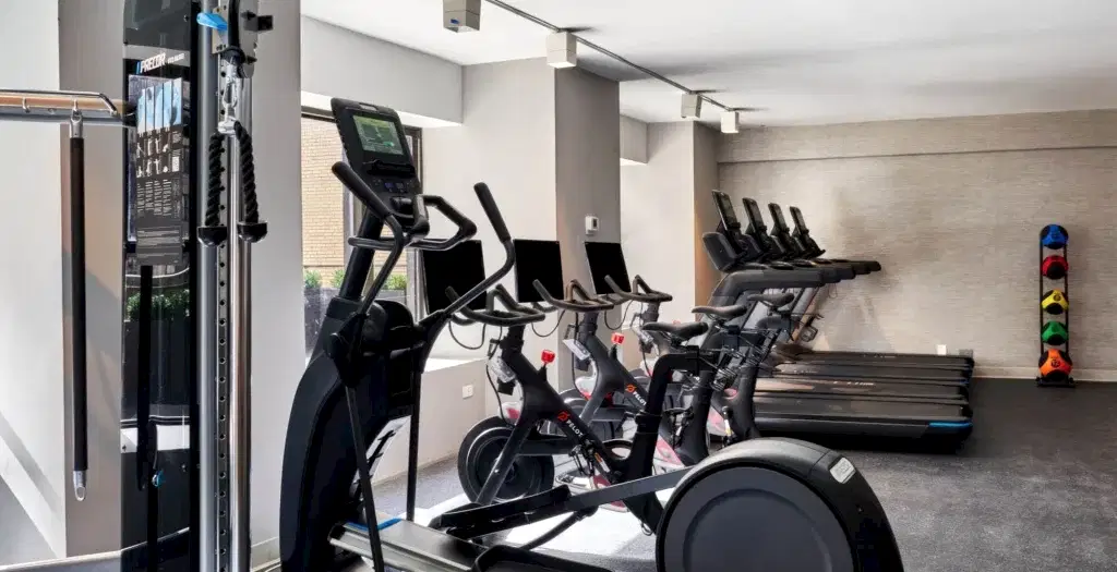 Exercise bikes and treadmills in a hotel gym